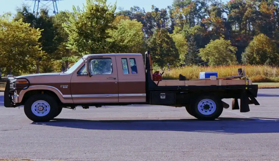 A flatbed pickup truck loaded up and ready for a haul-away run